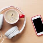 Smartphone, headphones and coffee